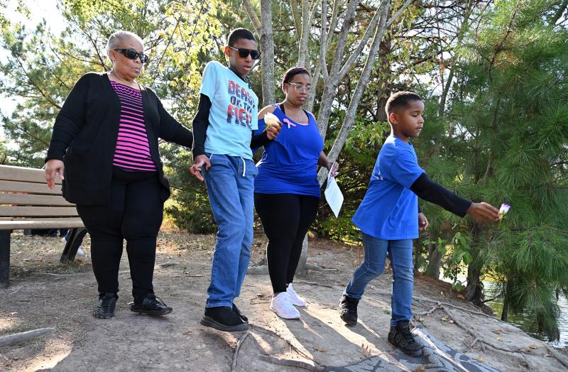 Tossing flowers to remember those lost are (l-r) Cynthia Taylor, Jahsan Warren, Latoya Taylor and Ahmere Parker. Latoya walks for her son Todd Arnez Sincere Wilson, who was born in early October 2007.