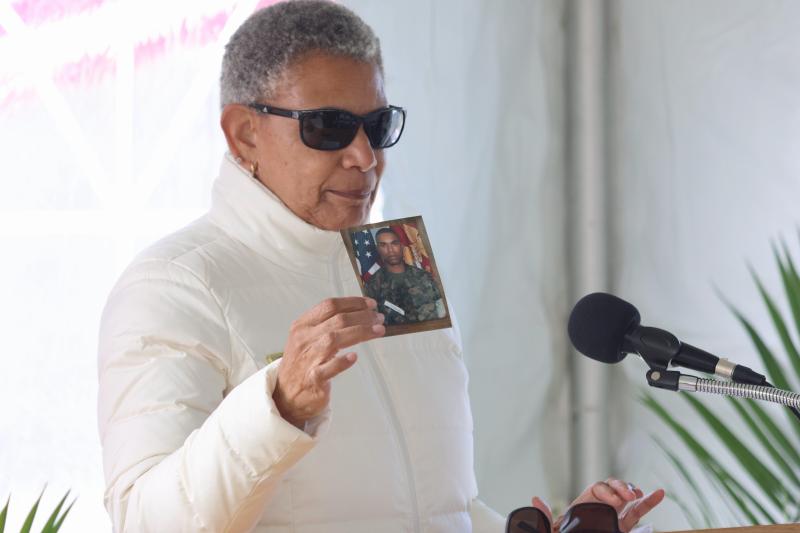 Joni Resilard, a Delaware Gold Star mother, holds a photo of her son, Capt. Jahmar Resilard, who was a Marine Corps F/A-18 pilot who died in a training accident in Japan.