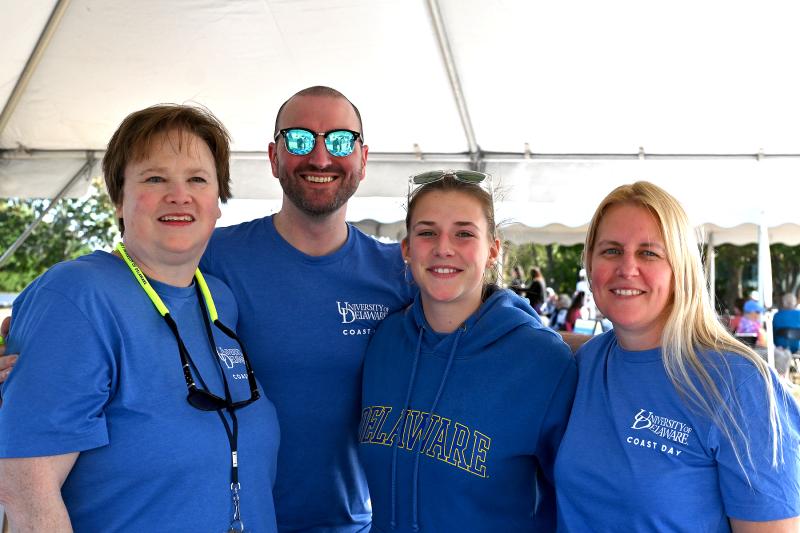 Selling shirts and other related items for Coast Day are (l-r) Tammy Beeson, Kevin Liedel, Olivia Hans and Lori Hans.