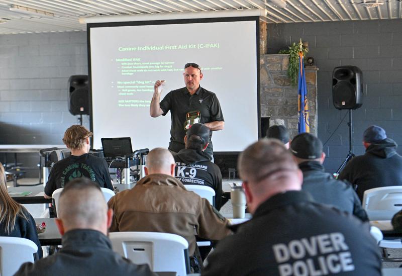 Todd Seay, instructor with the Vet Tac Group, shows the equipment each K-9 officer should have in their pack.