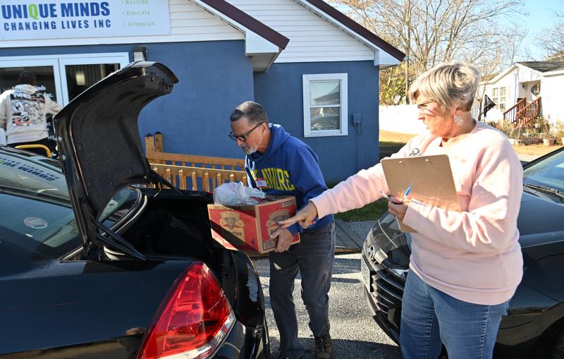 Volunteer Lori Kunkle gives directions to volunteer Jim Miller from Westminster Presbyterian Church.