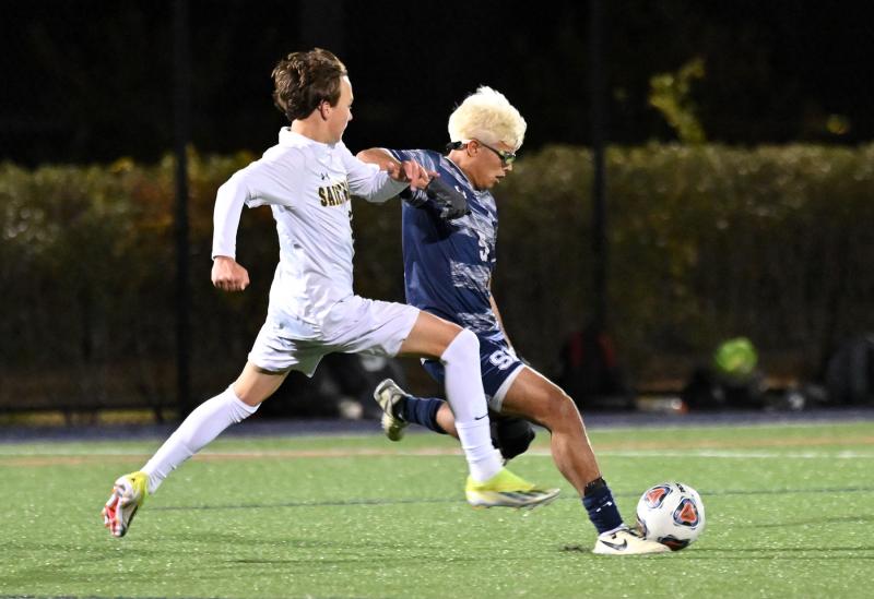 Sussex Academy senior Esteban Lara Nieto speeds the ball away from Saint Mark’s junior Gabriel Arick.