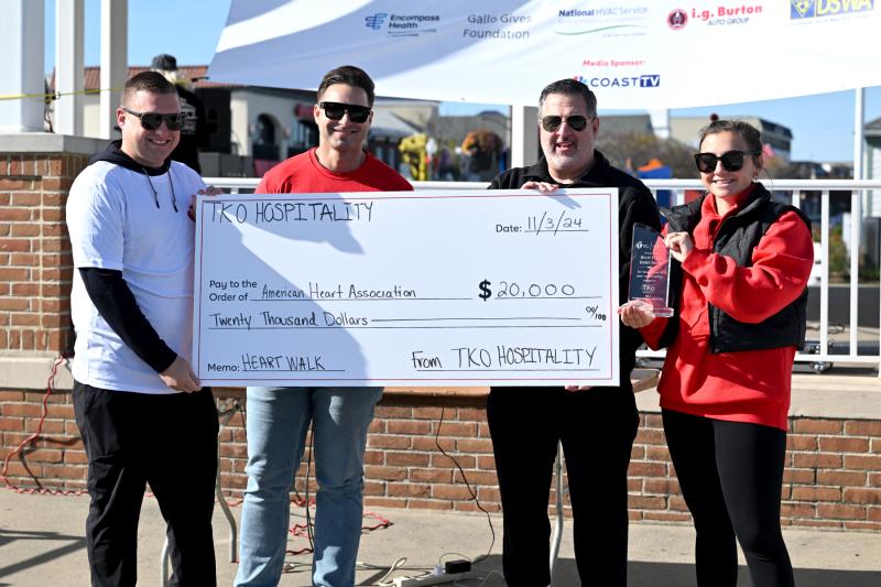 Presenting a check in the amount of $20,000 to the American Heart Association of Delaware from TKo Hospitality are (l-r) Drew DiFonzo, vice president of operations for TKo Hospitality; Tom Trobiano, executive director Cardiovascular & Neuroscience Services at Beebe Healthcare; Jim Murphy, executive vice president of the American Heart Association of Delaware; and Athena Moustakas, communications director of the American Heart Association of Delaware.