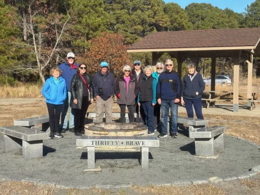 Members of the Preserve Our Park Coalition gathered at the site of the proposed cottages Nov. 25. Shown are (l-r) Gail van Gilder; Joe Pika; Rep.-Claire Snyder-Hall, D-Rehoboth Beach; Tom Stock; Norma Morrison; John Bracco; Elaine Simmerman; Barry Denenberg; Rich Weissmann; and Sally Boswell. PHOTO COURTESY SALLY BOSWELL