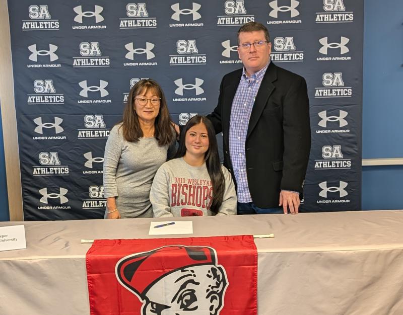 Morgan Leeper will continue her playing career in both field hockey and lacrosse at Ohio Wesleyan University. She is shown with her mom Sunny, a teacher at Sussex Academy, and her dad Tom.