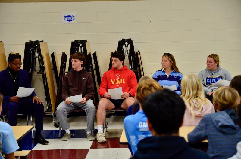 Beacon Middle School Assistant Principal Dontez Collins asked the four athletes (l-r) Ronan Pressler, Patrick Donahue, Lina Frederick and Alivia Heers a series of questions about recruiting and college selection.