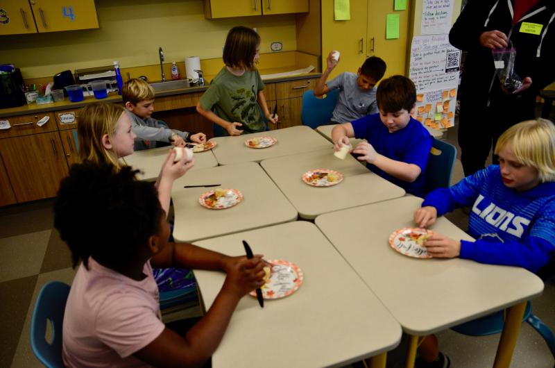 Students took turns churning the bottle and learned how much work went into making butter. At this station are Melaney Daisey, Beighley Simmons, Grant Hudson, Grayson Lanan, Grayson Charles, Hayden Thornley and Jacob Moffit.