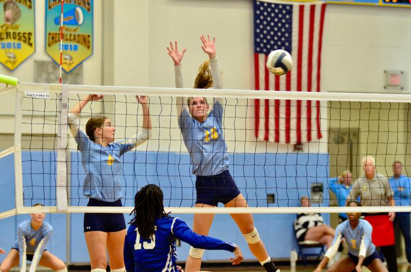 Cape sophomore Camilla Wilis joins Amalia Fruchtman on her right side as the junior blocks the ball.