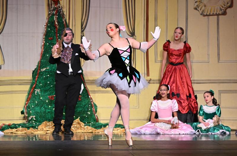 Drosselmeyer, played by Braeden Swain, brings life-sized dolls to entertain the children. The Columbine doll, Helena Zimmer, performs.