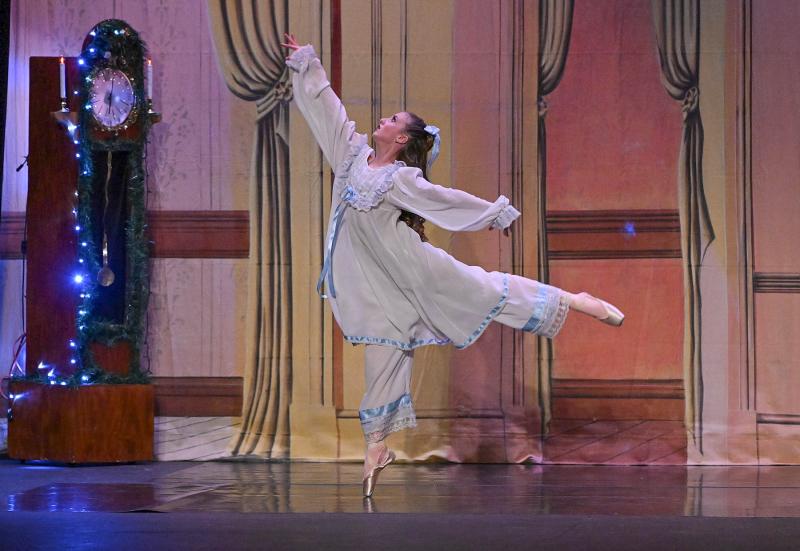 As the clock strikes midnight, Clara, played by Kinley Johnson, dances after the mice attack and steal the nutcracker.