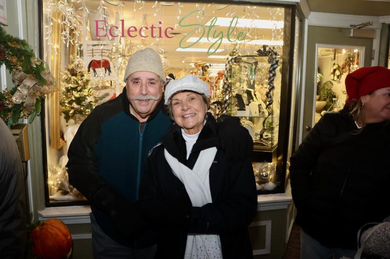 Frank Zinni, left, and Chris Neff wait in line for sticky buns at Lewes Bake Shoppe. They said Hospitality Night is their date night every year.