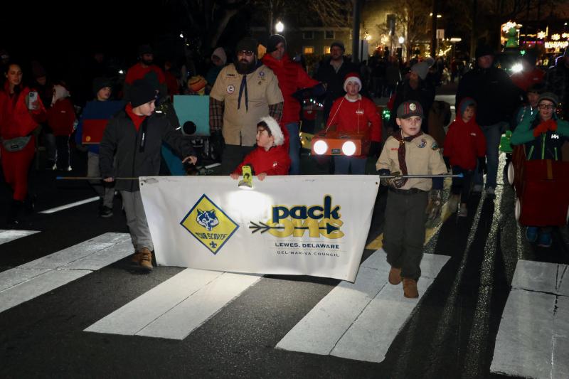 Cub Scout Pack 1 of Lewes walks up Savannah Road. The judges award them third place for youth organization float.
