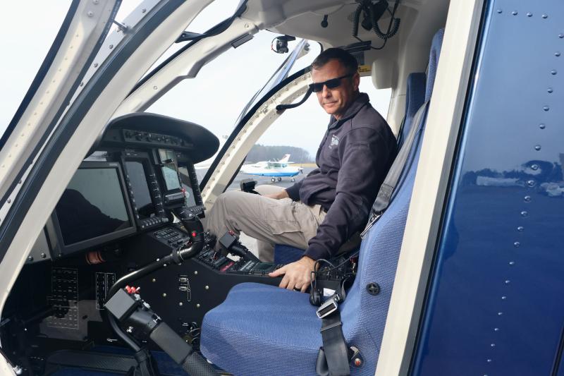 Bill White, DSP chief pilot, shows off the cockpit of N71SP. The aircraft has what is called a spartan interior, which eliminates some non-critical parts to reduce weight, and wear and tear.