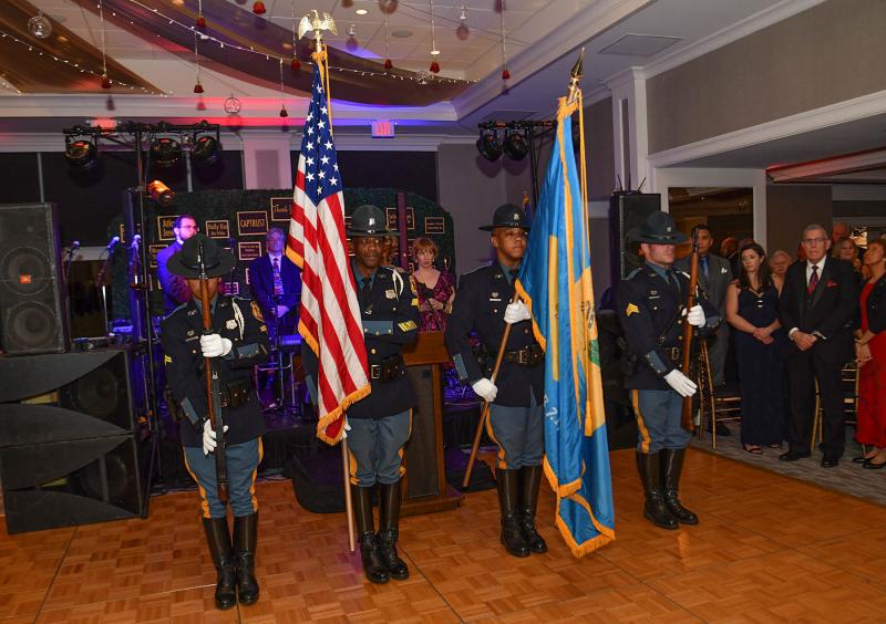 The Delaware State Police honor guard posts the colors before the event.