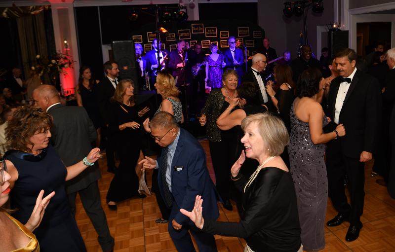 Attendees get down to the music of The Funsters.