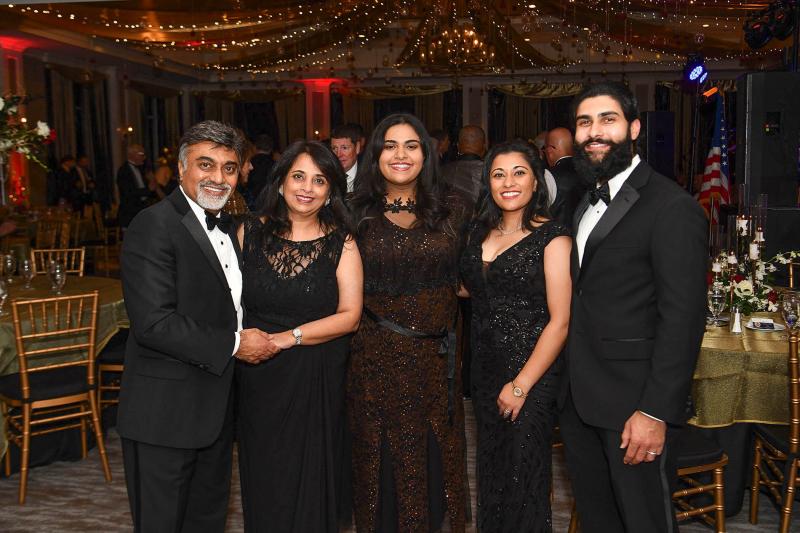 Harry Keswani and his family get together at the 12th annual Christmas gala. Shown are (l-r) Harry and Sonia Keswani, daughter Anjali Keswani and daughter Meg Keswani and Neel Divecha.  DAN COOK PHOTOS