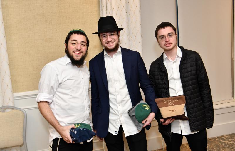 Rabbis in training assisting with the celebration are (l-r) Mendal Markel, Tzvi Vilenkan and Mendel Beitsh.