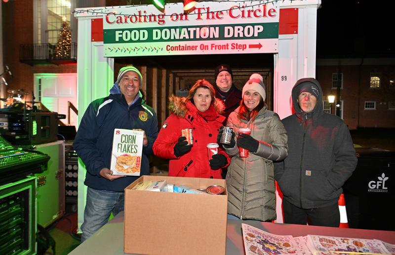 Packing the Pod with nonperishable items are Sussex County government workers (l-r) Will Godwin and Shari Collins, Chad Robinson from Food Bank of Delaware, and Casey Hall and Mike Pusey.