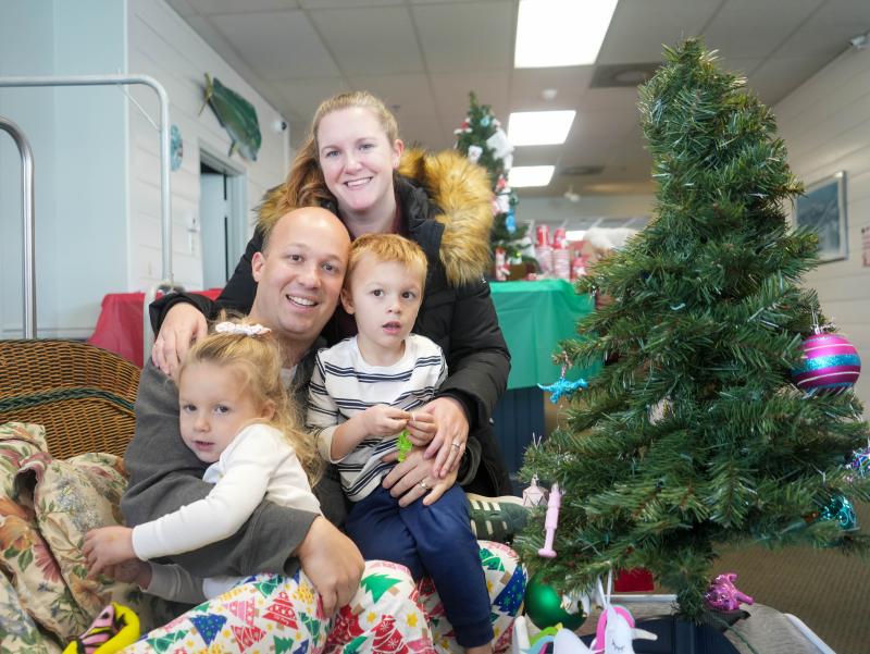 The Manieri family members smile while decorating at this year’s Trees of Cheer event at the Beacon Inn.
