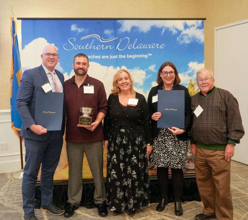 The Delaware Seafood Festival won Best New Event. Shown are (l-r) Sen. Russ Huxtable, D-Lewes; festival co-organizer Ryan Stevenson; Greater Millsboro Chamber of Commerce Executive Director Nadine Timpanaro; Rep. Claire Snyder-Hall, D-Rehoboth Beach; and Shore Smoke Seasonings sales director Paul Seibert.