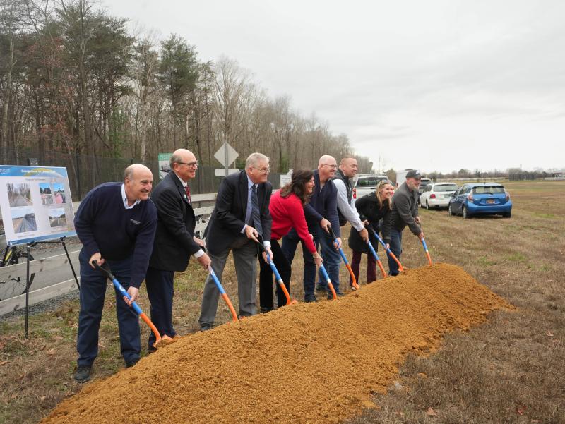 Holding shovels at DelDOT’s Dec. 18 groundbreaking ceremony, commencing the final phase of the Lewes-to-Georgetown Trail, are (l-r) Scott Rathfon, executive vice president of Century-Kleinfelder Engineering; Rep. Jeff Hilovsky, R-Long Neck; Doug Atkin, regional director for the Federal Highway Association’s Delaware chapter; Rep. Valerie Jones Giltner, R-Georgetown; Sen. Russ Huxtable, D-Lewes; Sen. Brian Pettyjohn, R-Georgetown; DelDOT Secretary Nicole Majeski; and Jeff Niezgoda, DelDOT’s assistant director of planning.