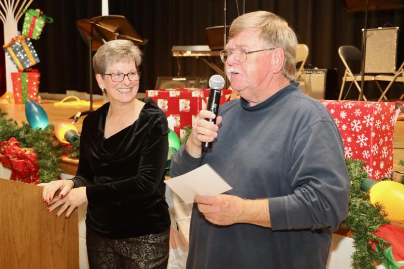 Rehoboth Beach Main Street presented Chuck Snyder with its Citizen of the Year Award at the annual Community Unity dinner Dec. 8. Snyder has served as a firefighter for 50 years. He has been Rehoboth Beach fire chief three times. He retired from his job with the city back in April. Carolyn Diefenderfer of Rehoboth Beach Main Street looks on while Snyder thanks the community. BILL SHULL PHOTOS