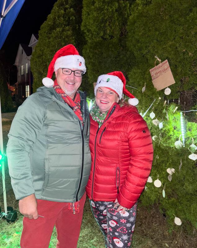 Chris and Jen Hinton represent the Dewey Business Partnership at its annual tree lighting at Fifer’s. The pair help run the gift tree.