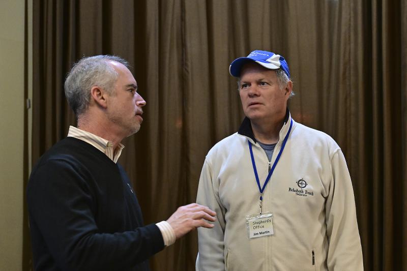 D.J. Hill, founder and owner of Lefty’s Alley & Eats, left, speaks with Jim Martin of the Shepherd’s Office.