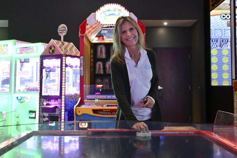 Suzanne Thurman, executive director of the MERR Institute, may be a nice person, but she’s a killer on the air hockey table.