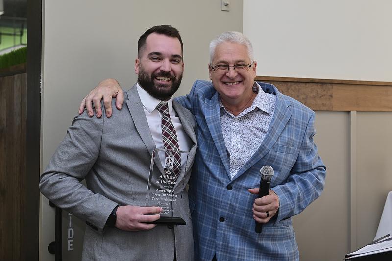 Cory Gurganious of AmeriSpec Inspection Services, left, receives the 2024 Affiliate of the Year Award from Bill Davis, newly minted SCAOR president for 2025.