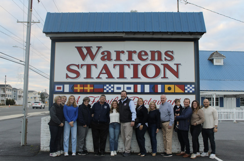 Marking the change of restaurant ownership from one family to the next are (l-r) Wendy Bartlett, Jessi Kate Bartlett, Anna Mumford, Paula Mumford, Jeff Mumford, Caroline Wetzelberger, Scott Mumford, Elise Mumford, Jamie Wetzelberger, Fred Wetzelberger II, Jack Wetzelberger, Fred Wetzelberger III, Victoria Wetzelberger and Frank Pepe. SUBMITTED PHOTO