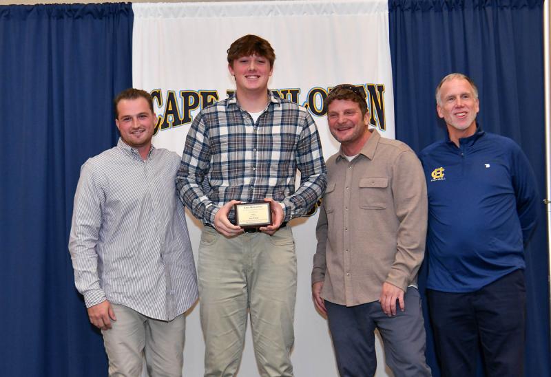Jase Truitt is presented with the JV Sportsmanship Award. Shown are (l-r) JV coach Ben Ashby, Truitt, coach Jack Frederick and coach Mark Mayer.