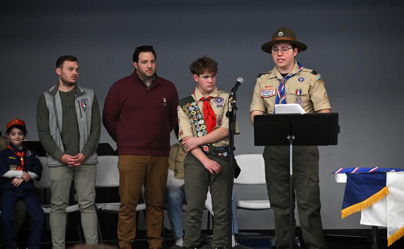 Eagle Scout Ryan Stuhlmuller, Troop 1, 2023 Eagle Scout, prepares to administer the Eagle Scout oath while Ian’s brother, Steven Matalavage, left, and brother David Campbell look on.