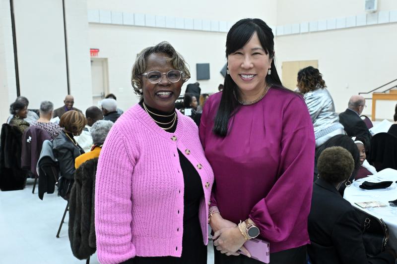 Former Cape Henlopen School District administrator and board member Janet Maull-Martin, left, greets DSEA-NEA Director Gloria Ho.