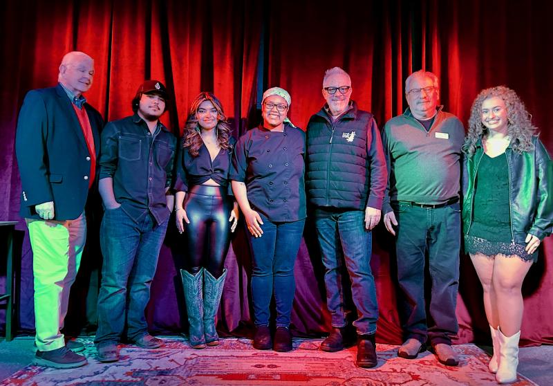 Gathered at the benefit concert are (l-r) Jim Rivette, Paul Kares president; Aiden Villegas and Abrielle Villegas of Abrilu; Alondra Estrada, chef intern and scholarship recipient; Paul Cullen, Paul Kares co-founder; Fran Simeone, Paul Kares director of development; and Lindsey Brewster of Abrilu. SUBMITTED PHOTO