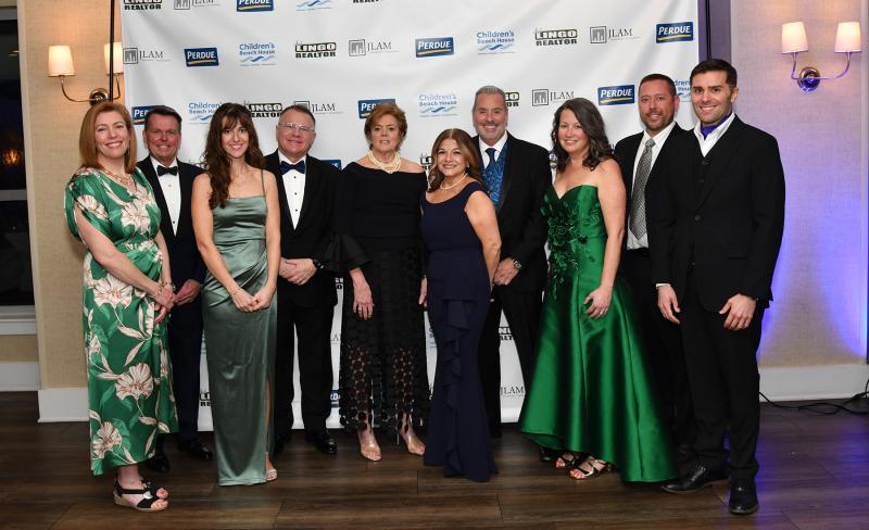 CBH staff and board members posing for a pre-gala picture are (l-r) Paula Janssen, board of trustees secretary; Tom Sheridan, board of trustees president; Paula Baker, culinary director; Richard Garrett, executive director; Patrice Tosi, vice president of finance; Zaida Guajardo, senior director of development; Anthony Orman, chief operating officer; Tara Becker, vice president of advancement; Justin Nixon, director of marketing; and Jonathan Freeman-Coppadge, director of communications. DAN COOK PHOTOS