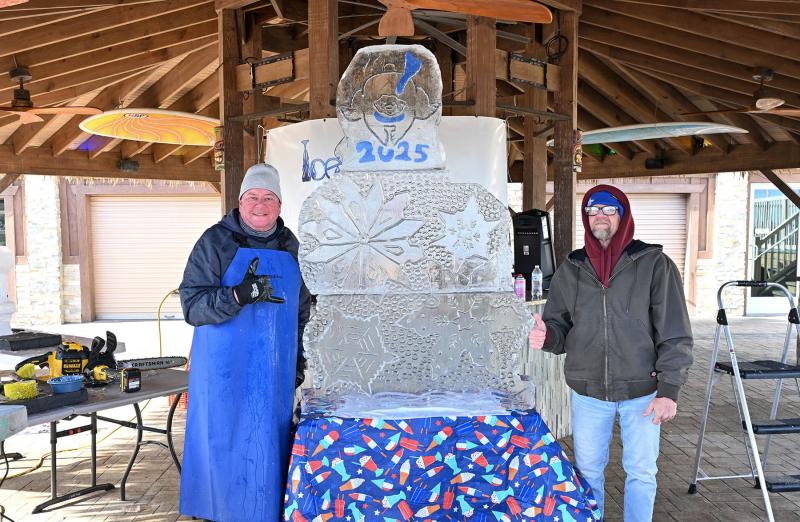 James Lauser, left, of the Ice and Spice Company made this ice sculpture with his friend Richard Stewart.