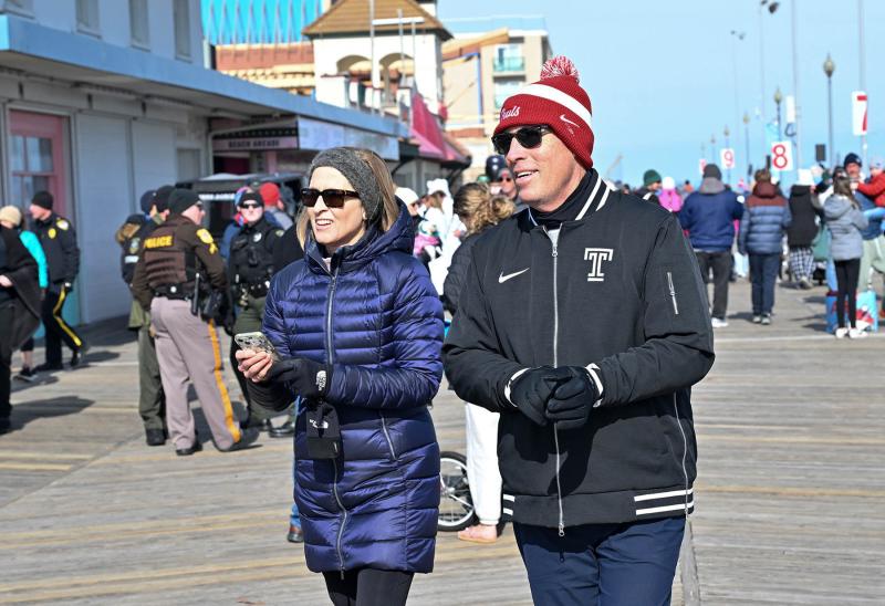 Temple University football coach KC Keeler and his wife Janice take a stroll on the Boardwalk before the plunge.