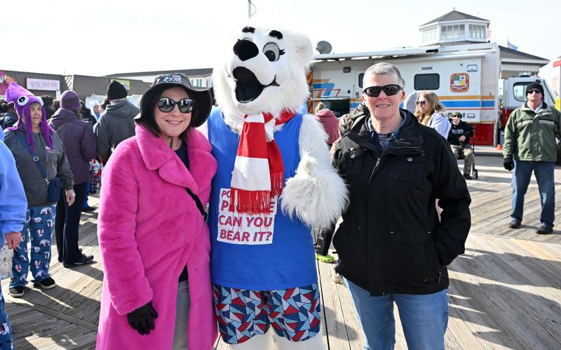 Rep. Claire Snyder-Hall, D-Rehoboth Beach, left, and her wife Mikki Snyder-Hall pose with Lewie P. Bear.