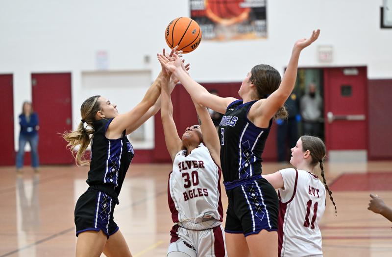 Royals’ Riley Barto, left, and Eve Bohinski battle for a rebound with the Silver Eagles’ Kaliyah Gunter.