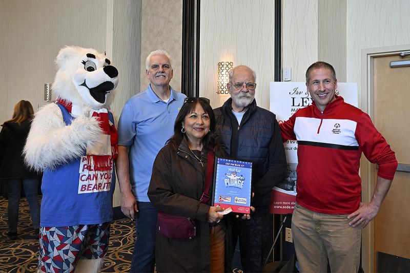 Attending a recognition ceremony are (l-r) Lewie P. Bear with Jim Watson, Sharonlee Diehl and Dennis Diehl of the Boardwalk Buddy Walk, and Special Olympics Delaware CEO and President David Halley.