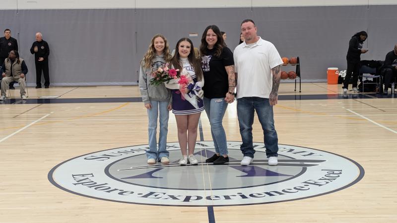 Sussex Academy senior Ava Huerta is escorted by her sister Chloe, mom Jinny and dad Steve. Her favorite memory was the first cheer tryout that reignited her passion for cheerleading, because she knew she was part of the first squad in school history.