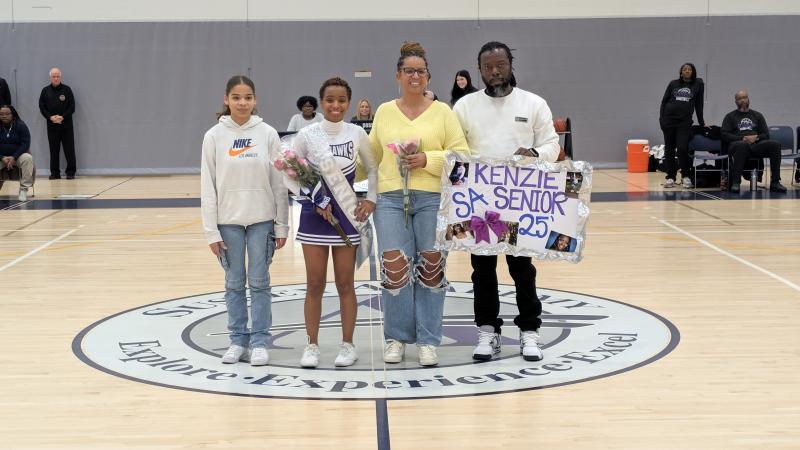 Seahawks senior Kenzie Harmon is escorted by her sister Aubrie, her mom Corri and her dad Steven. Harmon hopes to be an interior designer and will major in design at Bowie State University.