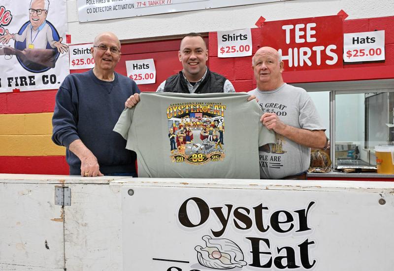 Delaware Sen. Brian Pettyjohn, center, sells souvenir T-shirts with Mike Vincent, left, and Ric Marvel.