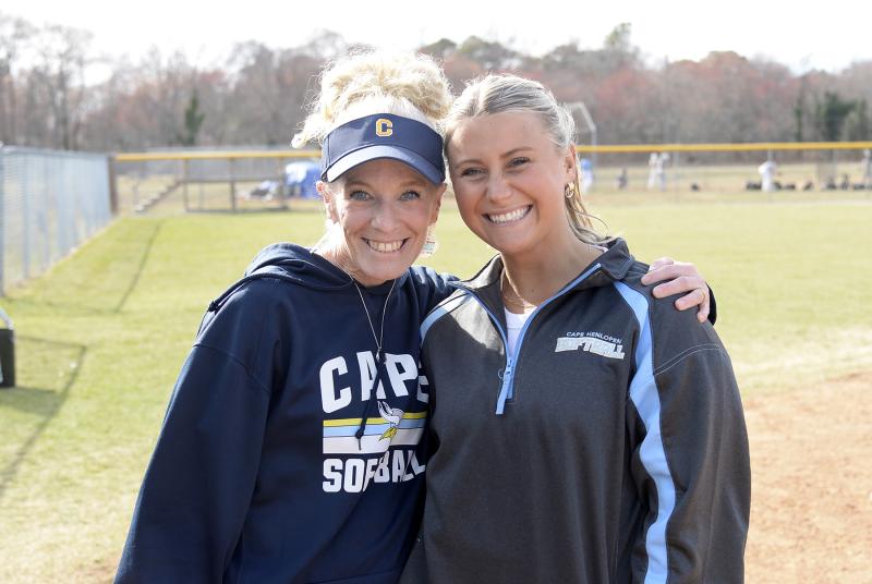 Assistant coaches Allison Sullivan, left, and Sydney Ostroski Cambron played for the Vikings in 1996 and 2016, respectively.