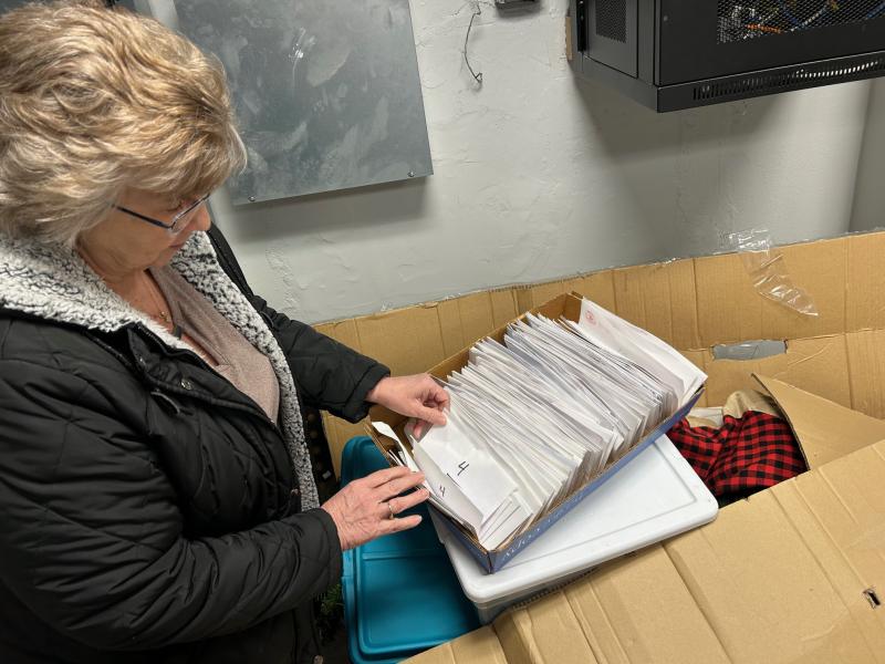 The Milton Fire Department Auxiliary will celebrate the 50th anniversary of its Penny Party fundraiser in April. The event is the auxiliary’s longest-running fundraiser and will feature several new wrinkles to celebrate the anniversary. Auxiliary President Mary Ann Warrington goes through some of the envelopes that are used as part of the games associated with the Penny Party. RYAN MAVITY PHOTOS