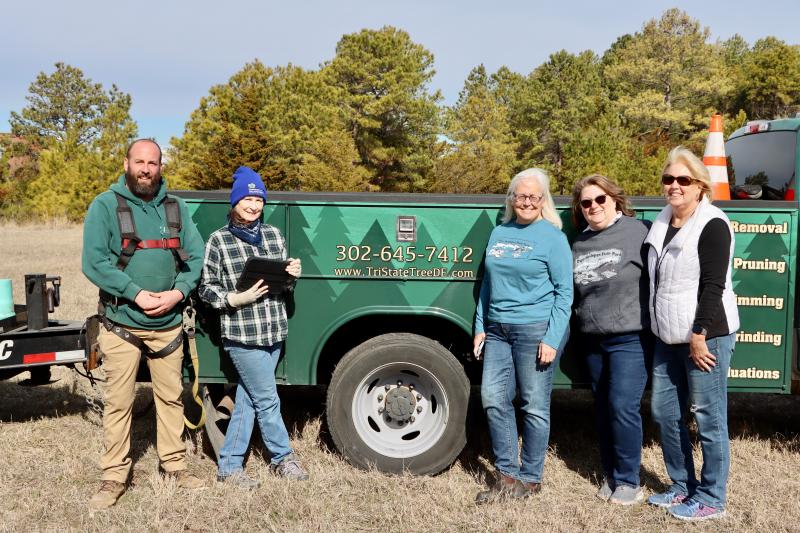 Tri-State Tree donated time and equipment to help the Friends of Cape Henlopen State Park install a starter nest for ospreys. Shown are (l-r) Dan Baker, Tri-State Tree; Jodi McLaughlin, osprey expert; MJ Candoux, Friends board member; Suzanne Langwell, Friends media and marketing; and Polly White, Friends vice president. BILL SHULL PHOTO