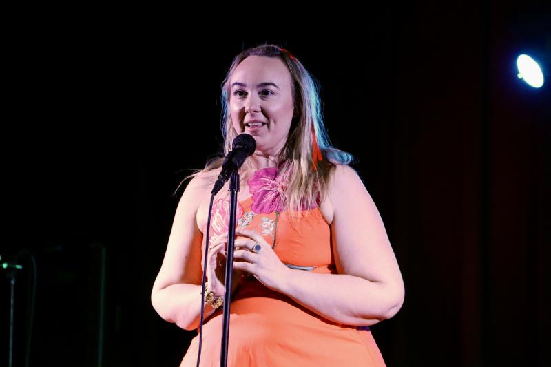 Megan Kee, owner of the Megan Collective restaurant group, tells the audience about the donation she made to the silent auction – dinner for up to 10 people at one of her restaurants.