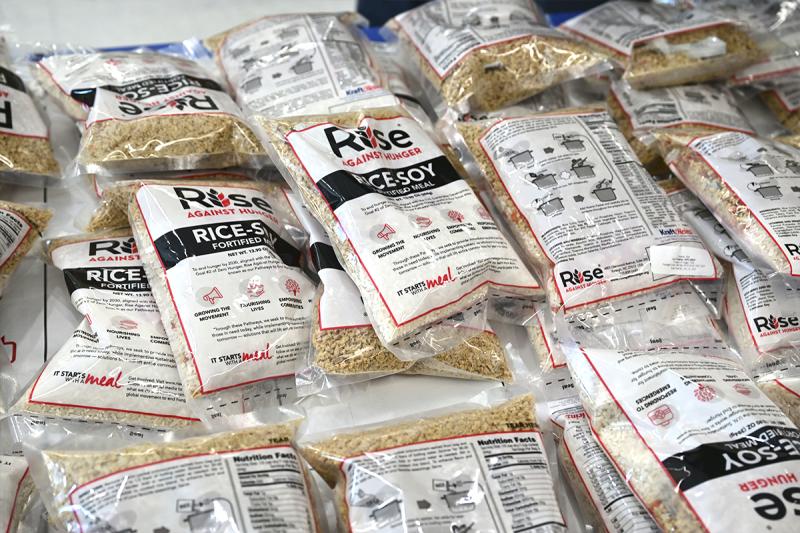 Meal packets are ready to go into the boxes for shipping. Each packet contains rice, soy, dehydrated vegetables, and a micronutrient packet containing 20 essential vitamins and minerals.