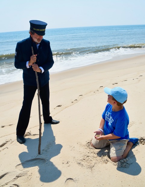 Surfman Levi Lynch helps Ben understand how the life-saving service operated in the late 19th century in a new book written by Corrine Litzenberg of Lewes. RON MACARTHUR PHOTO